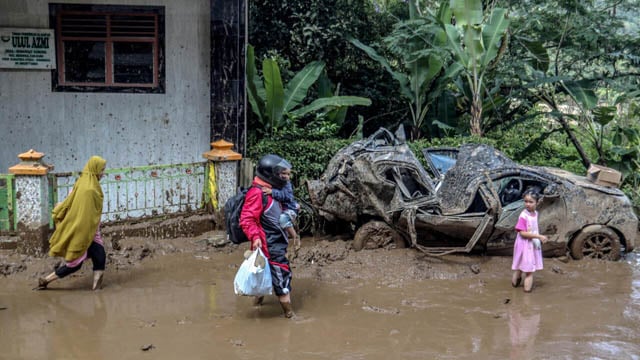 Indonesia digs out as flooding, landslide death toll hits 20