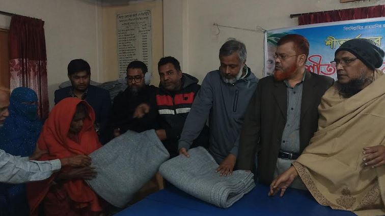 Winter clothes distributed among distressed families in Sherpur