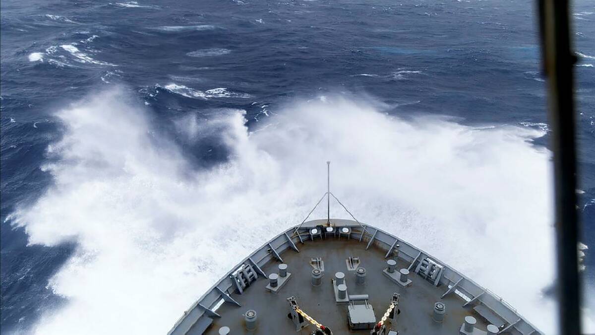 Rower plucked from path of tropical cyclone off Australia
