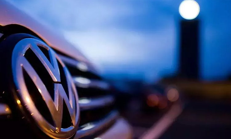 Volkswagen says tariffs will dampen business as profit plunges