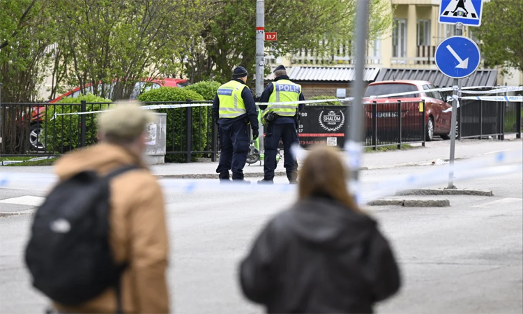 Police arrest four in Swedish triple murder probe, release teen