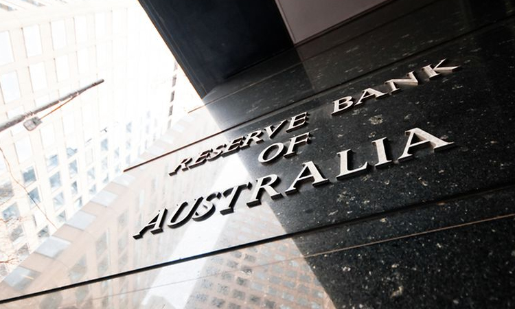 Australian central bank cuts key rate but warns of global disquiet