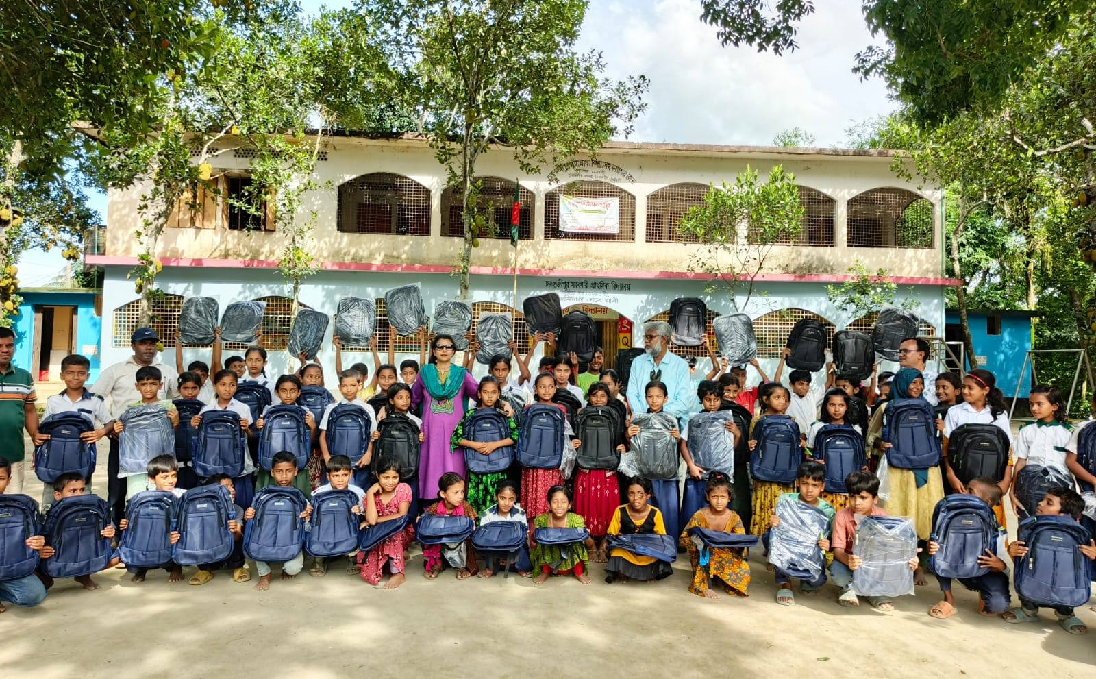 Schoolbags, tiffin boxes distributed among 515 students at Hossainpur upazila