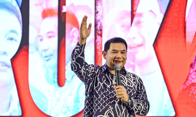 Malaysian minister resigns after losing party poll to PM's daughter