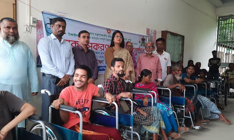 Wheelchairs distributed among 65 persons with disabilities in Tangail