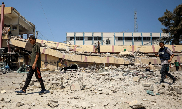 Rescuers say Israeli strike killed at least 12 people in south Gaza