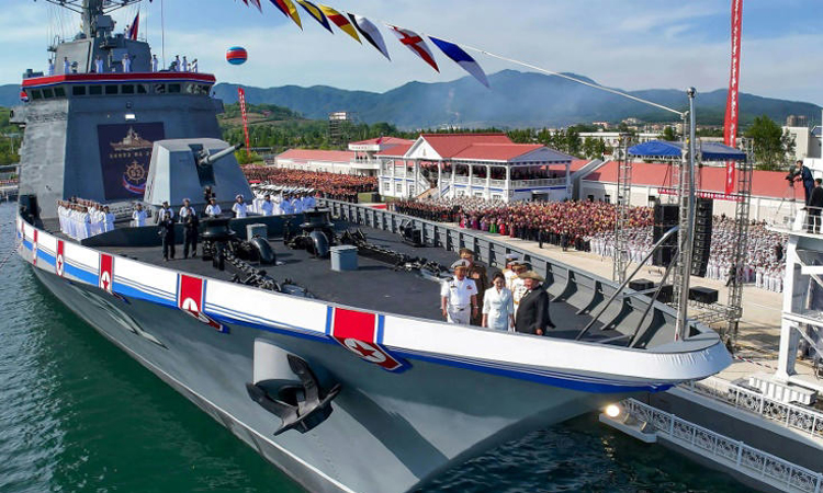 North Korea launches repaired destroyer, Kim vows two more to come