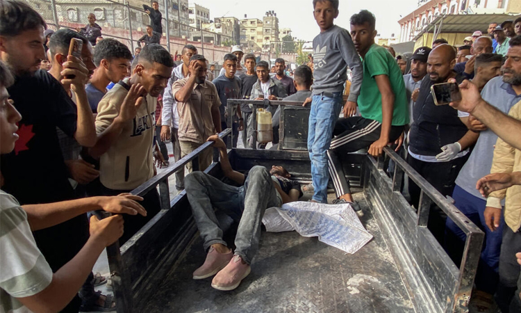 Gaza rescuers say Israel army kills more than 50 people near aid site