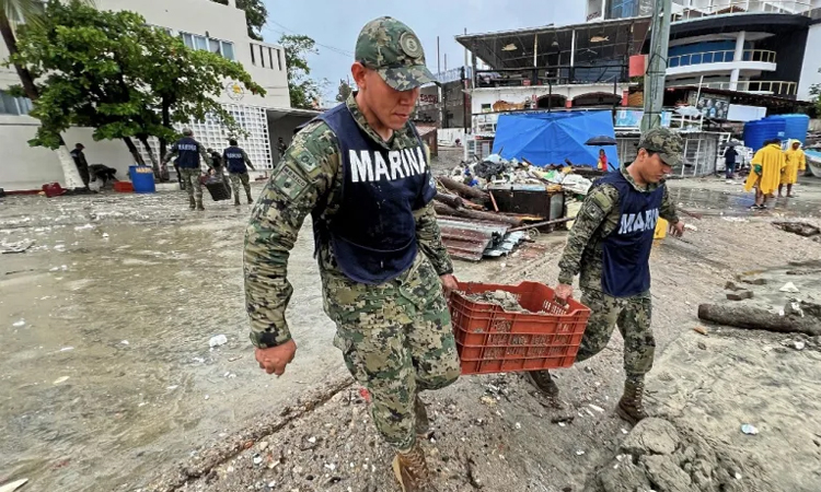 Cleanup begins as Hurricane Erick moves on from Mexican coast