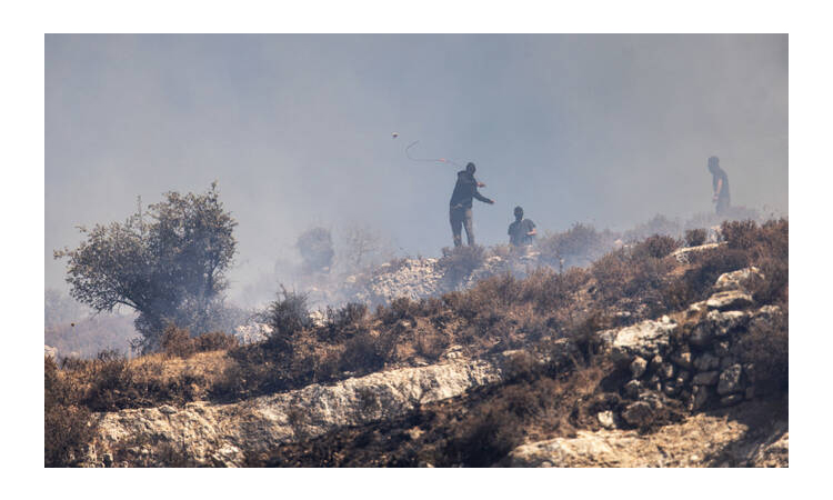 Settlers and Palestinians clash in West Bank village