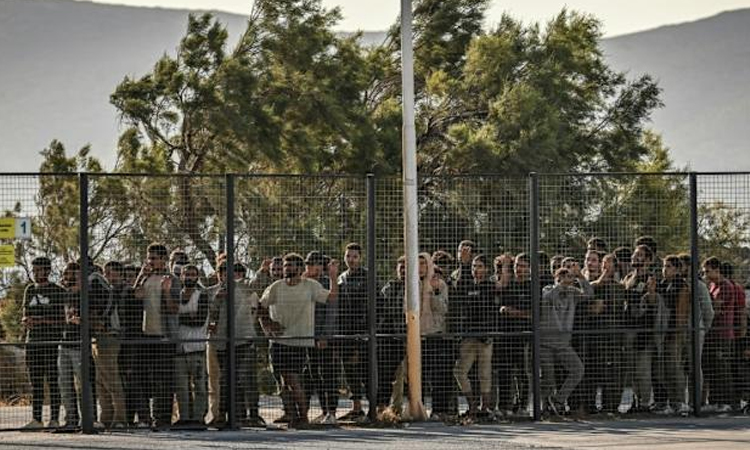 Greece detains first migrants arriving after asylum freeze