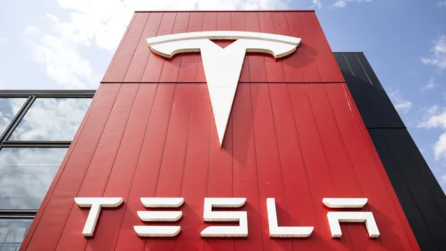 Tesla shares fall 8% after reporting profit drop
