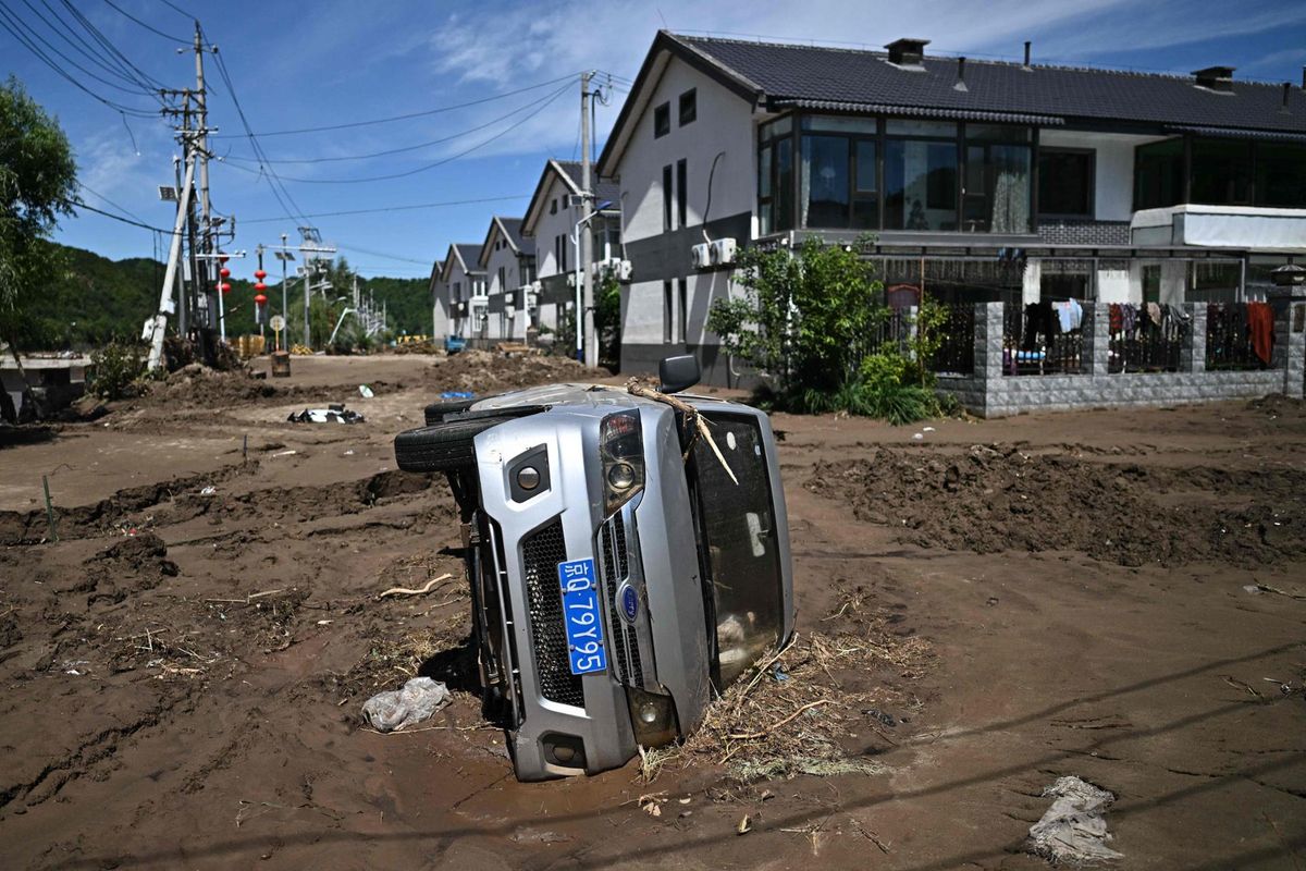 Beijing officials admit 'gaps' in readiness after rains kill dozens