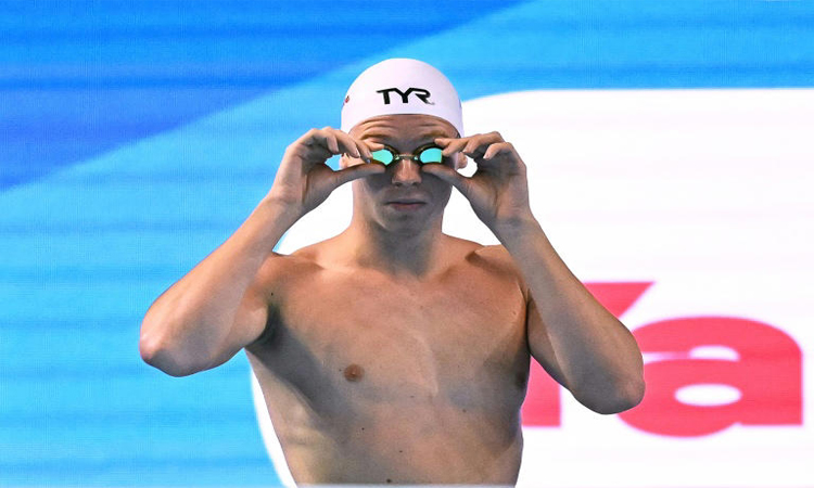 'Struggling' Marchand targets second gold at swimming worlds