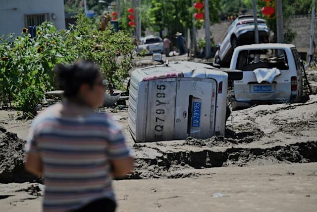 Beijing issues new storm warning after deadly floods     