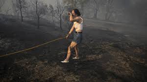 Spain suffers third wildfire death, Greece beats back flames