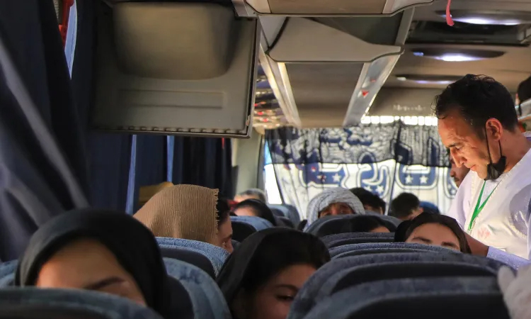 Scores killed after bus carrying returning Afghan migrants hits truck