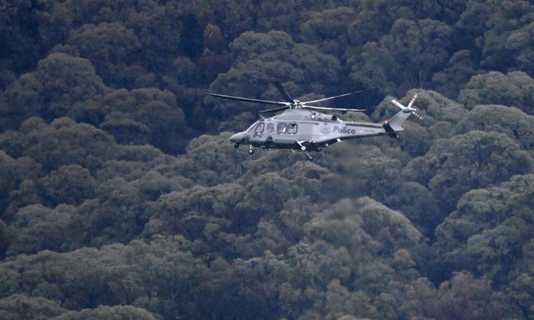 Police search Australian bush for gunman after two officers killed