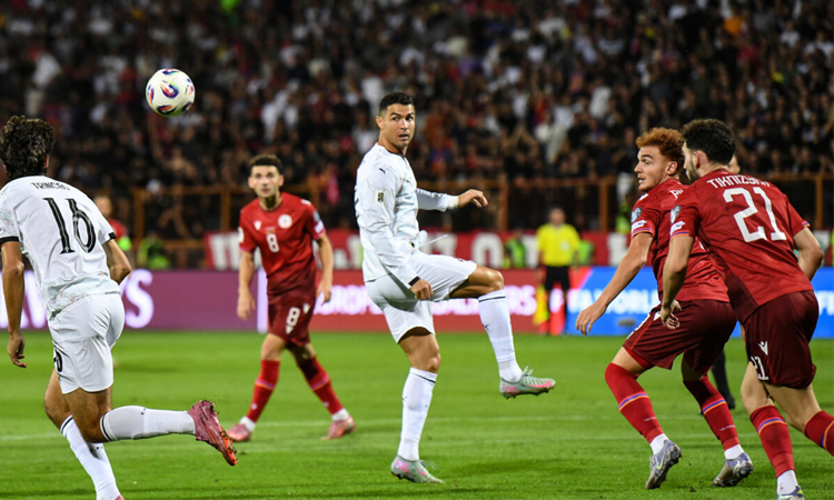 Poignant Portugal cruise, England unbeaten in World Cup qualifying