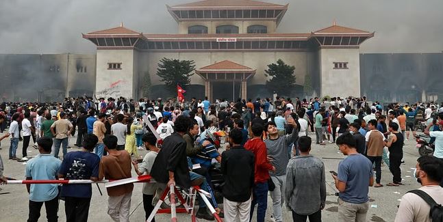 Nepal protesters set parliament ablaze as PM quits