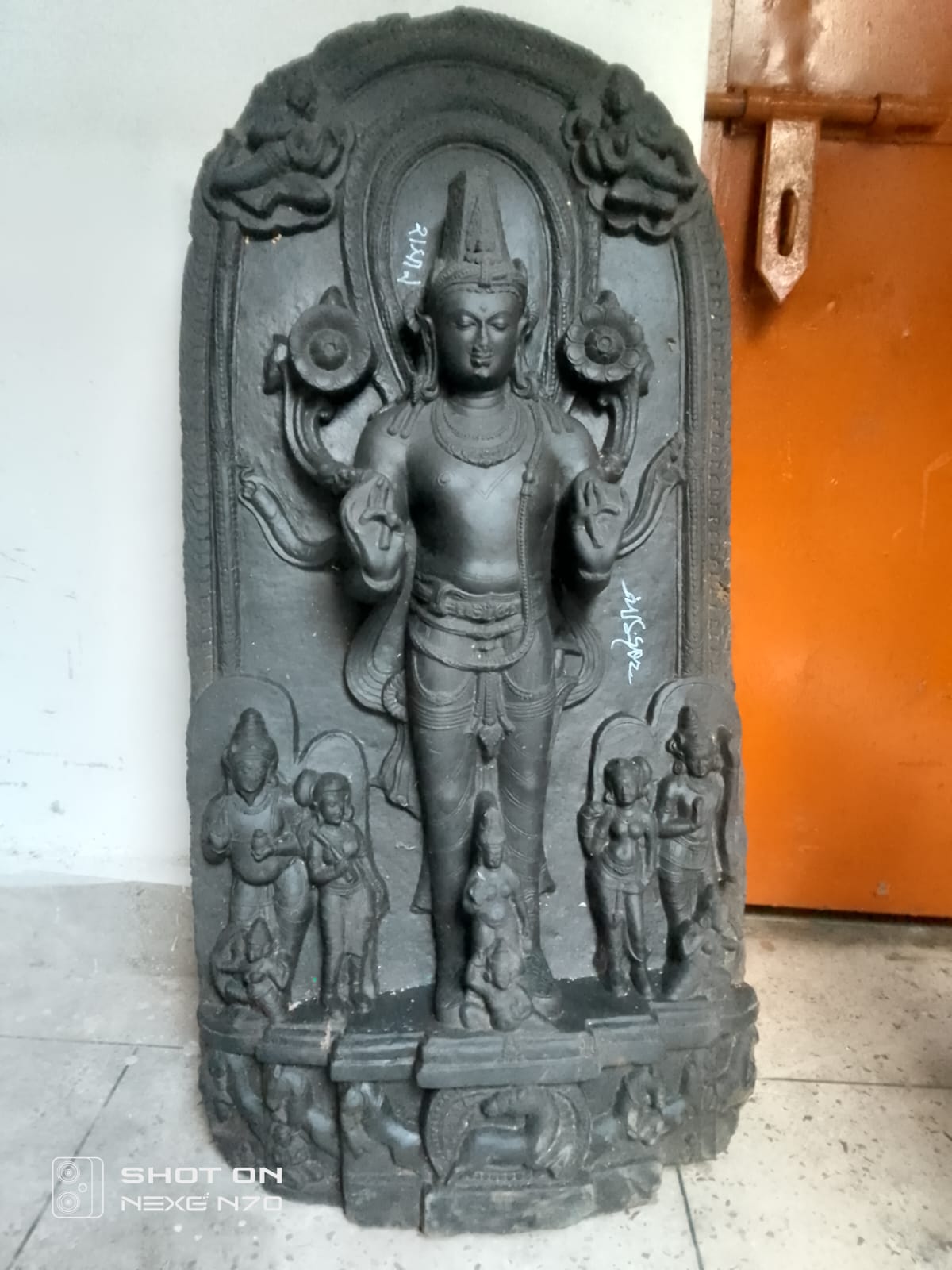 One held with blackstone Vishnu idol in Savar