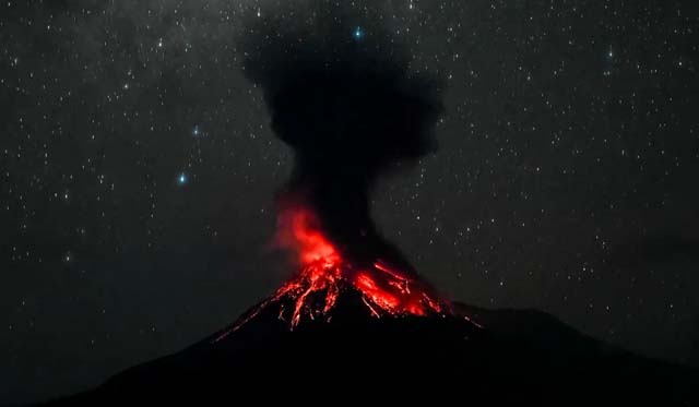 Indonesia volcano erupts, belching ash into night sky