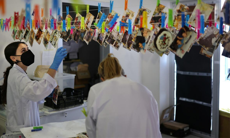 After deadly floods, Spaniards fight to save photos