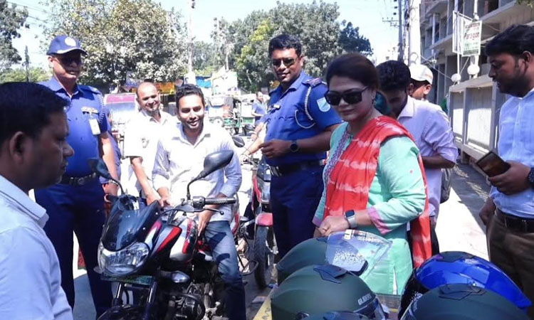 Free helmets distributed among bike riders marking Safe Road Day 