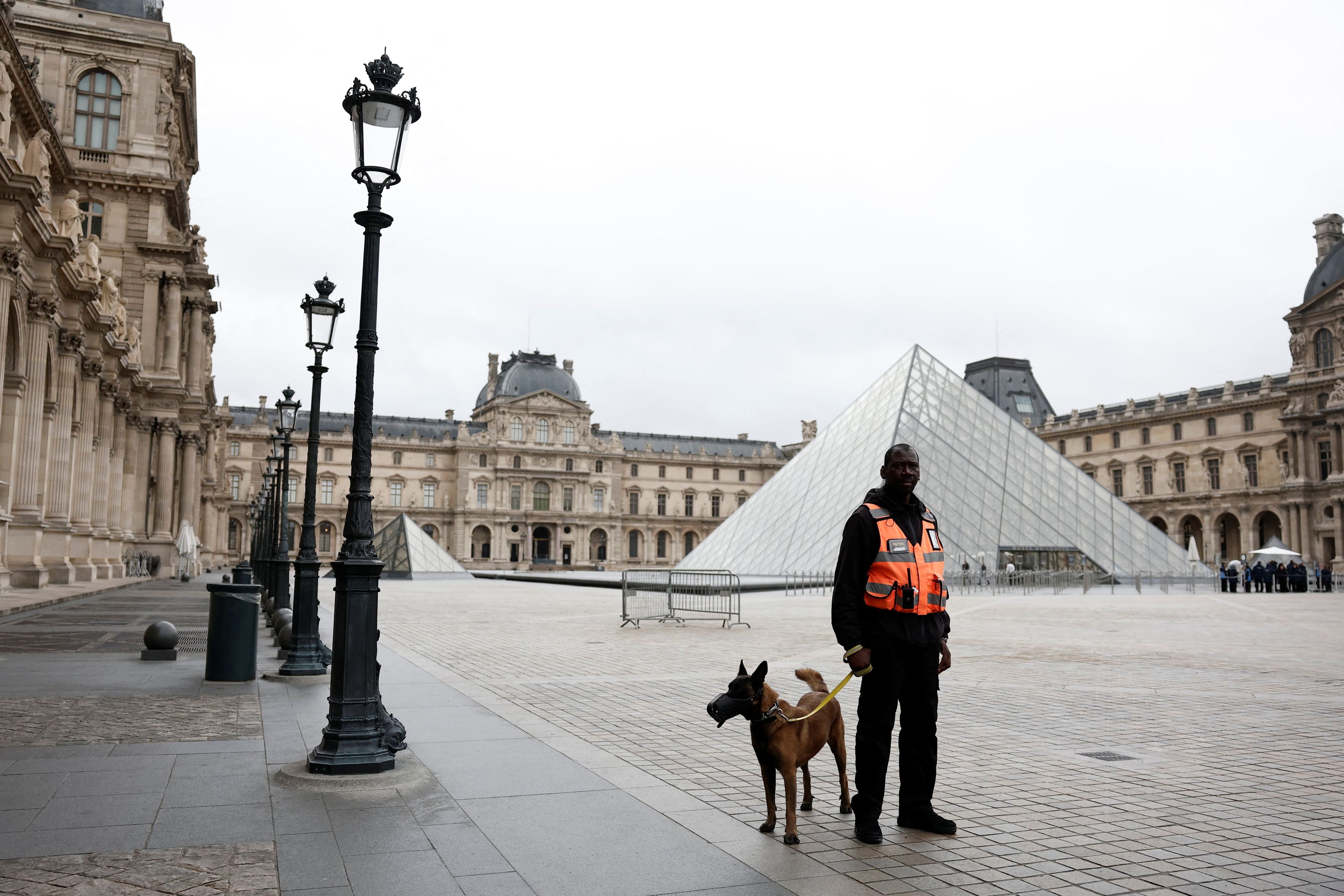 France's Macron orders tighter security as Louvre reopens doors