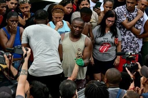 'They slit my son's throat' says mother of teen killed in Rio police raid