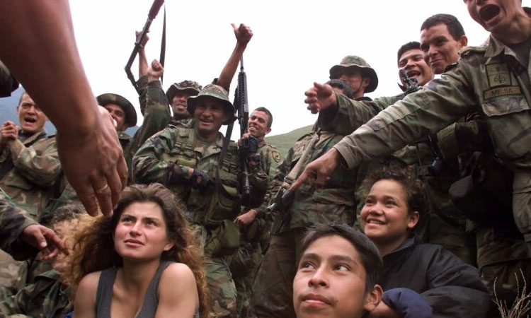 Young Colombian mourns kidnapped teen brother killed by military