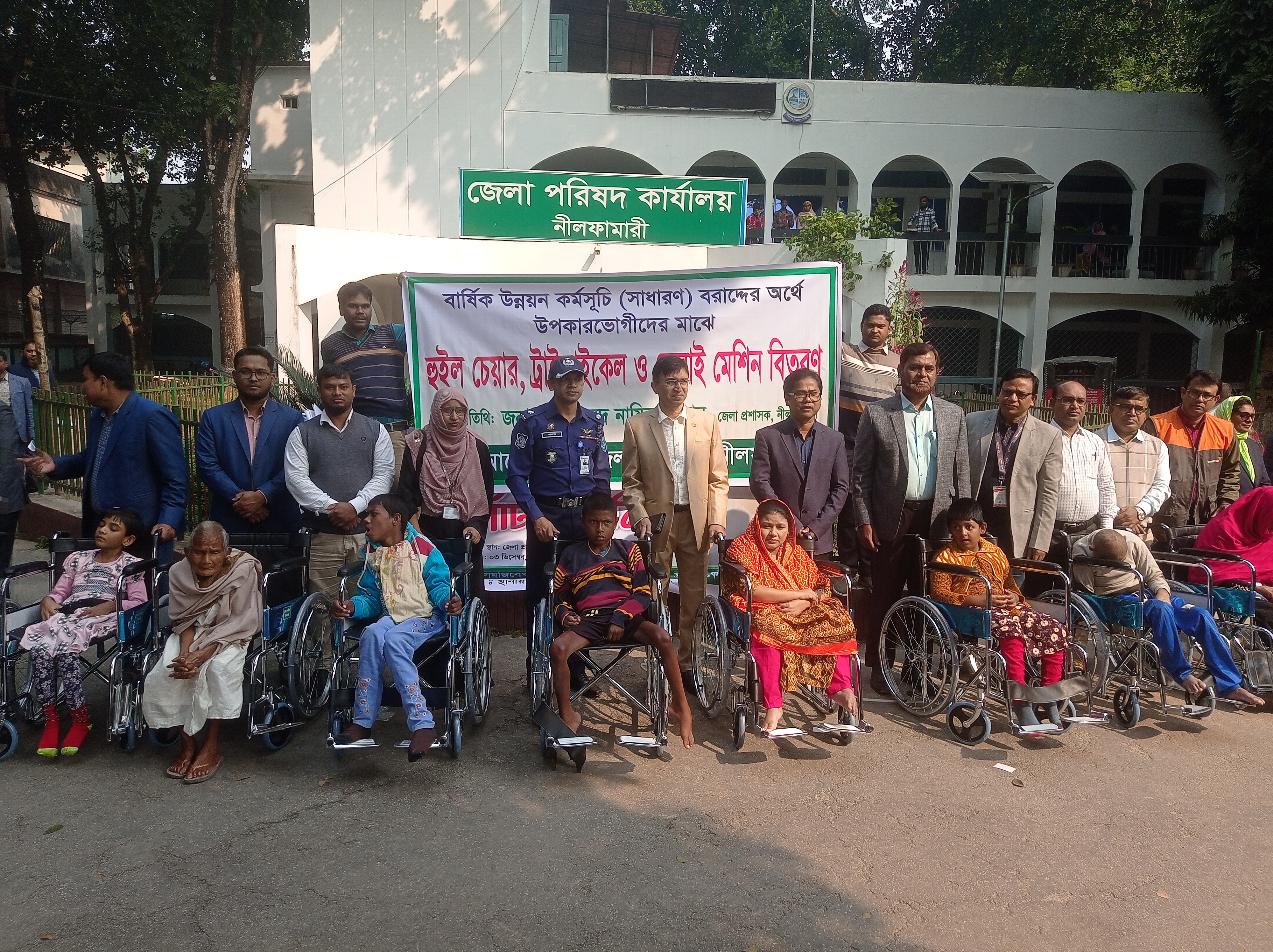 Wheelchairs, sewing machines distributed to disabled persons in Nilphamari