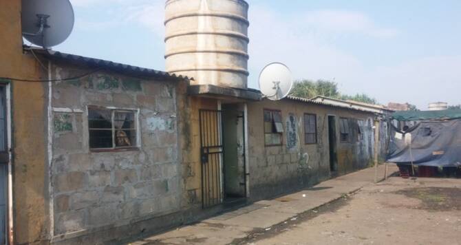 12 people, including 3 children, killed in South Africa hostel shooting 