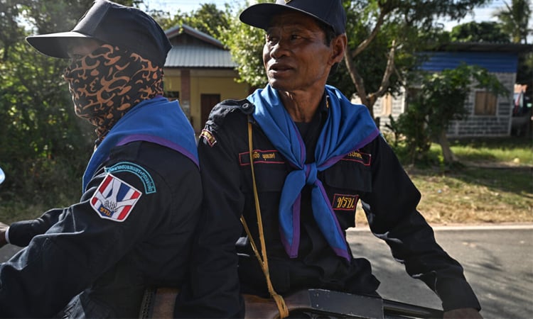 Volunteers patrol Thai villages as artillery rains at Cambodia border