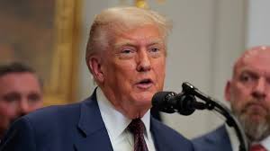 Trump heads into Davos storm, with an eye on home