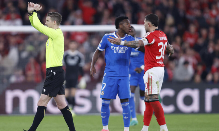 Vinicius stunner helps Real Madrid edge Benfica in play-off marred by alleged racism