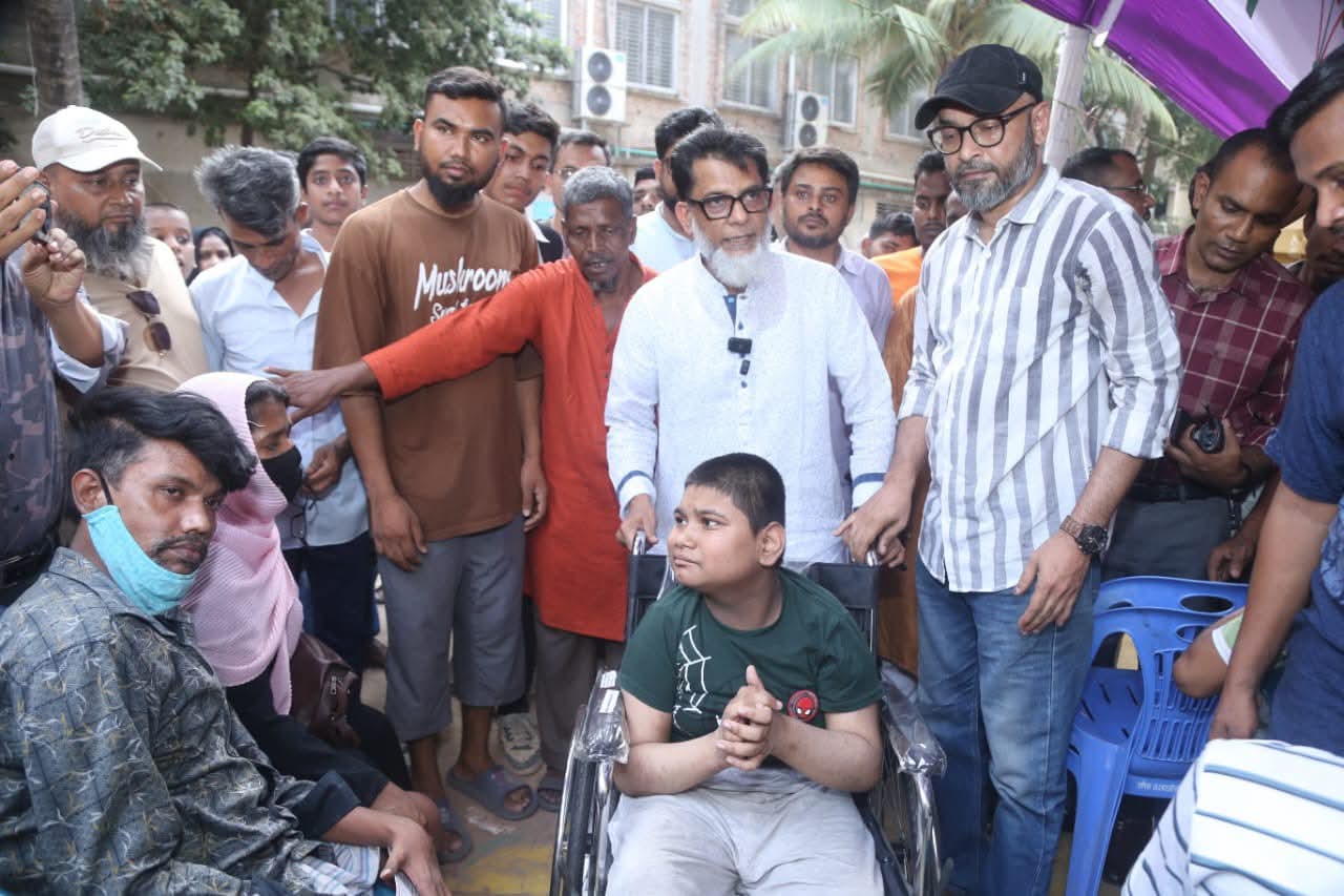 Habibur Rashid distributes wheelchairs among physically challenged 