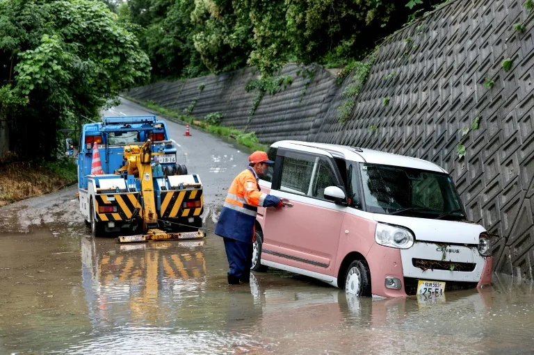 Floods kill two in Taiwan as twin storms approach Japan