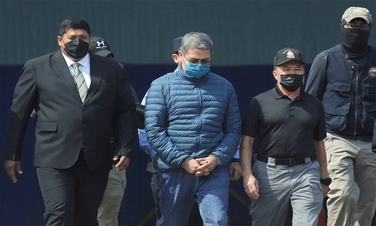 Honduran ex-president returns home after Trump pardon