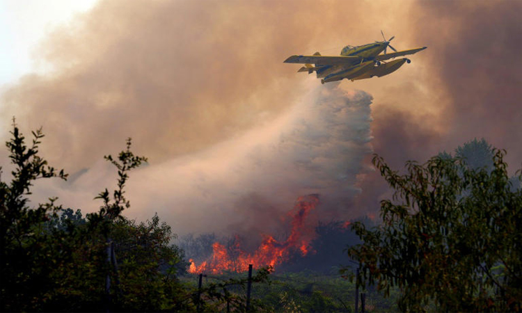 With minutes to flee, Spain fire evacuees grab what they can